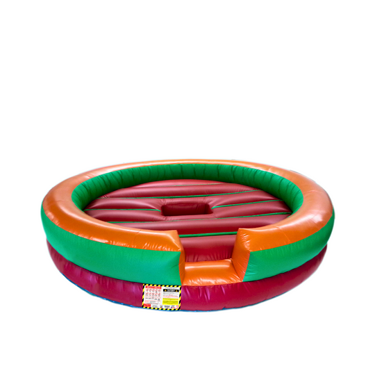 Round inflatable mechanical bull bed in red, green, and orange colors, designed for safe riding experiences. Round inflatable mechanical bull bed in red, green, and orange colors, designed for safe riding experiences.