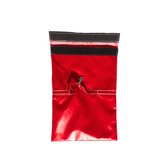 Red sandbag cover designed for securing a commercial bounce house, featuring a zipper and hook for easy attachment.