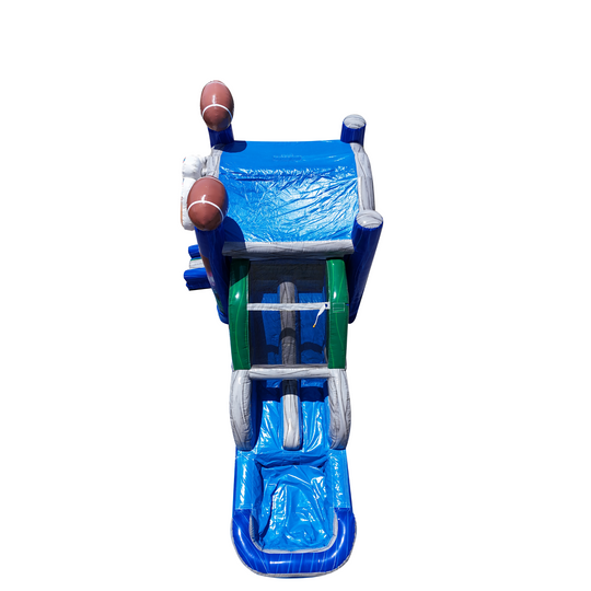 Bright blue inflatable combo water slide featuring a slide and climbing area, with football decorations on top.