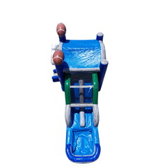 Bright blue inflatable combo water slide featuring a slide and climbing area, with football decorations on top.