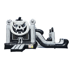 Black and white Halloween-themed inflatable combo featuring a large pumpkin face and a slide, suitable for festive events.