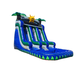 Large blue and green inflatable water slide featuring palm trees and a sun design, ideal for summer fun.