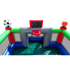 Colorful inflatable sports field with a soccer ball and basketball hoop, featuring a green floor and red accents.