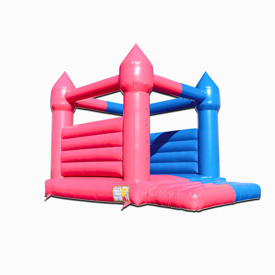 A pink and blue commercial bounce house for sale featuring a castle design, ideal for gender reveal parties.