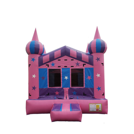Pink starry night castle bounce house with blue and purple accents, featuring two tall spires and a front entrance.