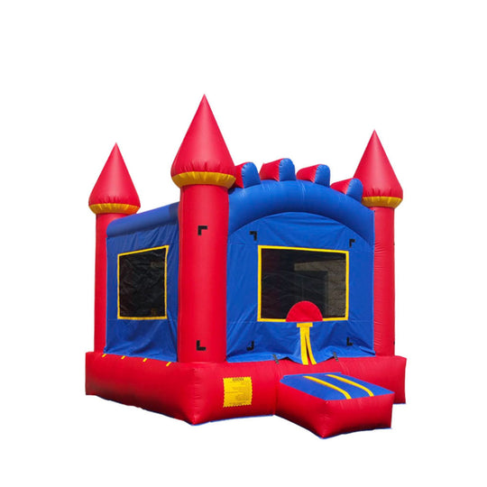 Bright blue and red commercial bounce house with castle-like design and pointed turrets, featuring a slide and large