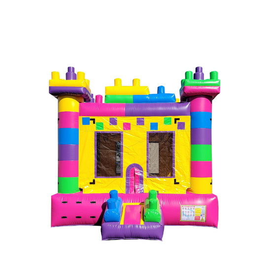 Colorful bounce house designed like a princess castle with pink, yellow, and purple accents, featuring two slides.