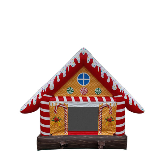 Colorful gingerbread house jumper with red and white stripes, candy decorations, and a large entrance, suitable for festive