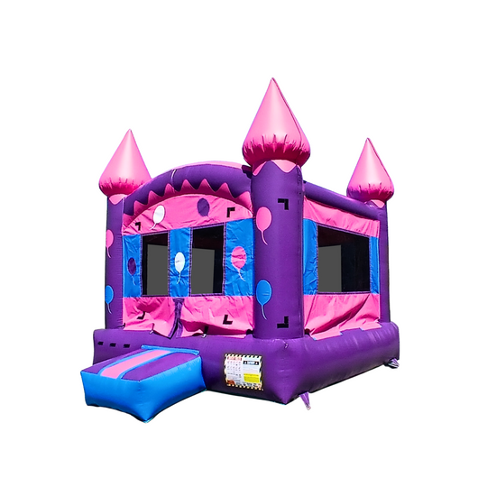 Bright pink and purple commercial bounce house with castle-like turrets and colorful polka dots.