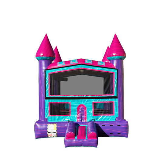 Bright pink and purple commercial bounce house for sale featuring castle-like towers and a slide.