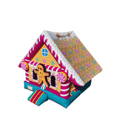 Colorful gingerbread house-shaped commercial bounce house for sale with pink and yellow accents.