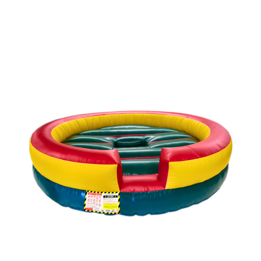 Round inflatable mechanical bull bed in green, yellow, and red colors, designed for safe bull riding experiences.