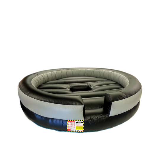 Round black and gray inflatable mechanical bull bed with safety features, suitable for events.