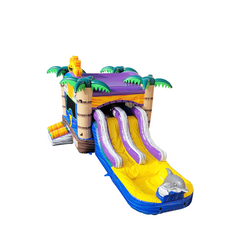 Colorful inflatable combo water slide featuring two slides and palm tree decorations, set against a white background.