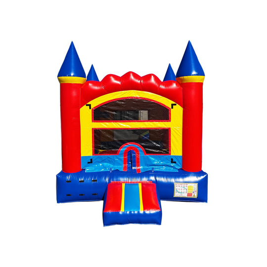 Colorful red and blue commercial bounce house for sale with castle-like towers and a slide entrance.