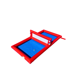 Red and blue inflatable volleyball court with a net, designed for outdoor play.