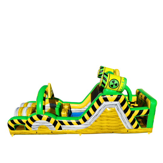 Bright yellow and green Toxic Waste Dump obstacle course inflatable featuring various climbing and sliding sections.