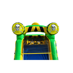 Bright green inflatable obstacle course with skull and crossbones decorations, featuring a toxic waste theme.