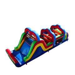 Colorful commercial obstacle course inflatable for sale featuring slides and climbing sections.