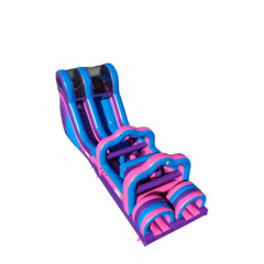 Bright pink and purple commercial obstacle course inflatable featuring slides and climbing sections, set against a white
