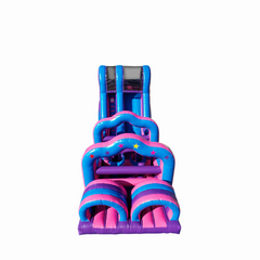 Bright pink and blue commercial obstacle course inflatable featuring slides and climbing sections.