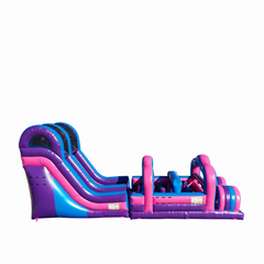 Colorful pink and blue commercial obstacle course inflatable for sale featuring slides and climbing sections.