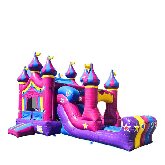 Colorful pink and purple inflatable castle with towers and a slide, designed as a commercial inflatable combo for sale.