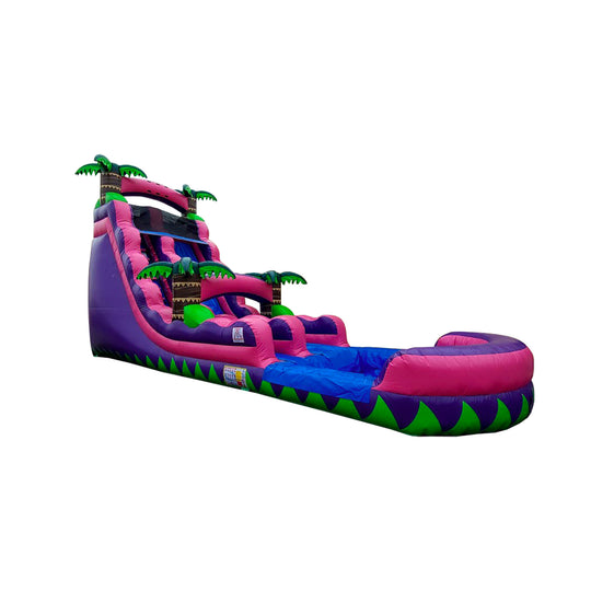 Bright pink and purple commercial water slide with palm tree accents, featuring a steep slide and a splash pool at the