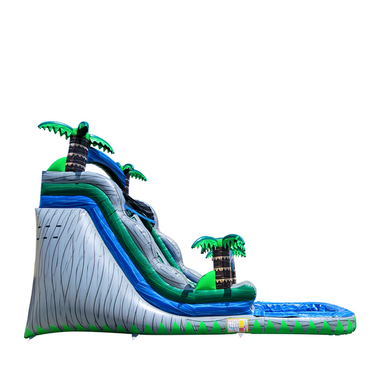 Large inflatable water slide featuring a tropical theme with palm trees, designed for fun in outdoor settings.