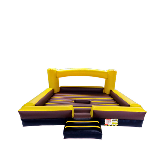 Mechanical bull inflatable bed 16x16 set up in an indoor venue