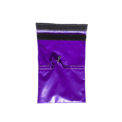 Purple sandbag cover designed for securing a commercial bounce house.