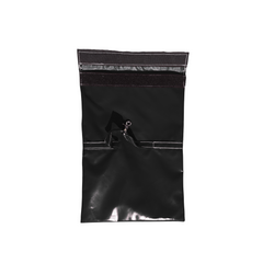 Black sandbag cover designed for securing a commercial bounce house, featuring a zipper closure.